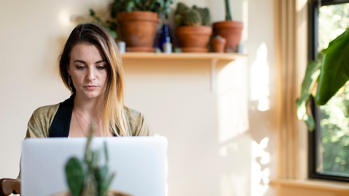 relaxed-woman-working-from-home-her-laptop-1200x675