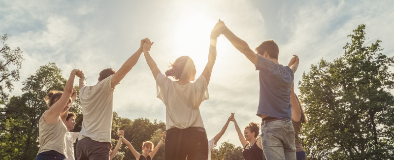 People holding hands in a circle
